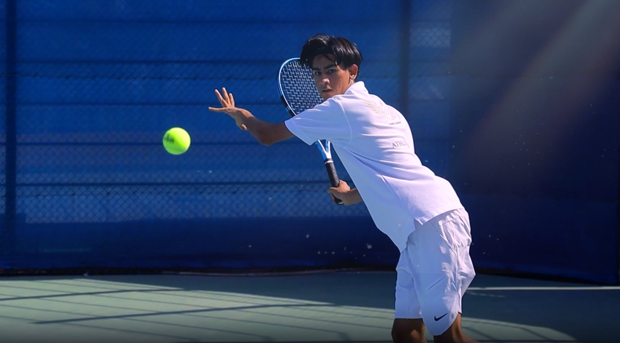 young teenager playing tennis in Abu Dhabi