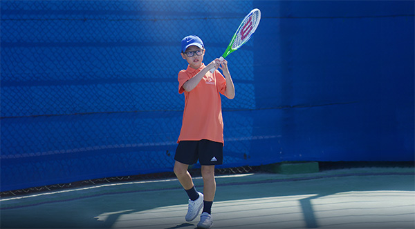 Kid playing tennis dubai